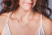 Load image into Gallery viewer, Ceejayeff letter A diamond necklace in yellow gold on a model