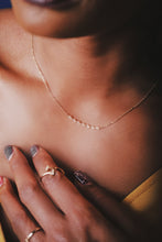 Load image into Gallery viewer, Ceejayeff Marq strand necklace in yellow gold on a model