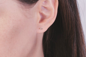 Ceejayeff single diamond Marq stud earring in rose gold on a model