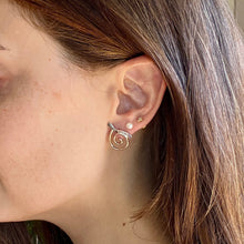 Load image into Gallery viewer, Close-up of a person wearing a spiral earring with a neutral background