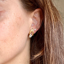 Load image into Gallery viewer, Close-up of a woman wearing gold earrings with small stones.