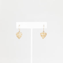 Load image into Gallery viewer, Heart-shaped gold earrings on a white background