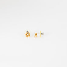 Load image into Gallery viewer, Gold heart-shaped earrings on a white background