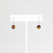 Load image into Gallery viewer, Pair of brown bead earrings on a white card against a light gray background