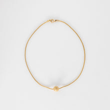 Load image into Gallery viewer, Gold necklace on a light gray background