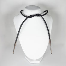 Load image into Gallery viewer, Black braided necklace on a white bust against a light gray background