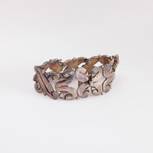 Load image into Gallery viewer, Silver bracelet with floral design on a white background