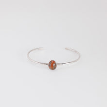 Load image into Gallery viewer, Silver bracelet with a red stone on a white background