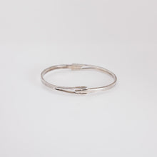 Load image into Gallery viewer, Silver bracelet on a light gray background