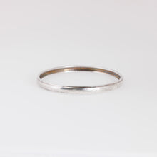 Load image into Gallery viewer, Silver ring on a light gray background