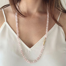 Load image into Gallery viewer, Woman wearing a pink beaded necklace with a white top.