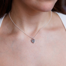 Load image into Gallery viewer, Necklace with a heart-shaped pendant worn by a person