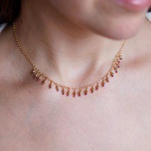 Load image into Gallery viewer, Close-up of a delicate necklace with small beads on a person wearing a white top.