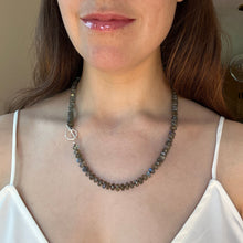 Load image into Gallery viewer, Close-up of a person wearing a beaded necklace with a neutral background
