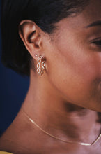 Load image into Gallery viewer, Ceejayeff diamond Marq hoop earring single diamond Marq stud earring in yellow gold on a model