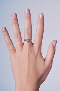 Ceejayeff curve ring and pear point gold and diamond ring on a hand