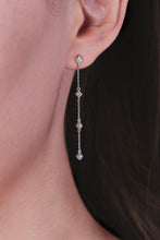 Load image into Gallery viewer, Ceejayeff long star find chain earring in white gold on an ear