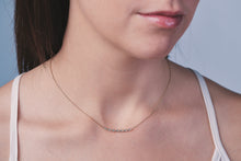Load image into Gallery viewer, Ceejayeff Marq strand necklace in yellow gold on a model